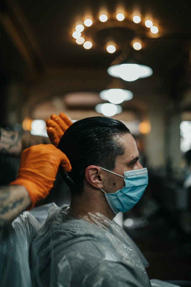 man in gray crew neck shirt wearing orange jacket